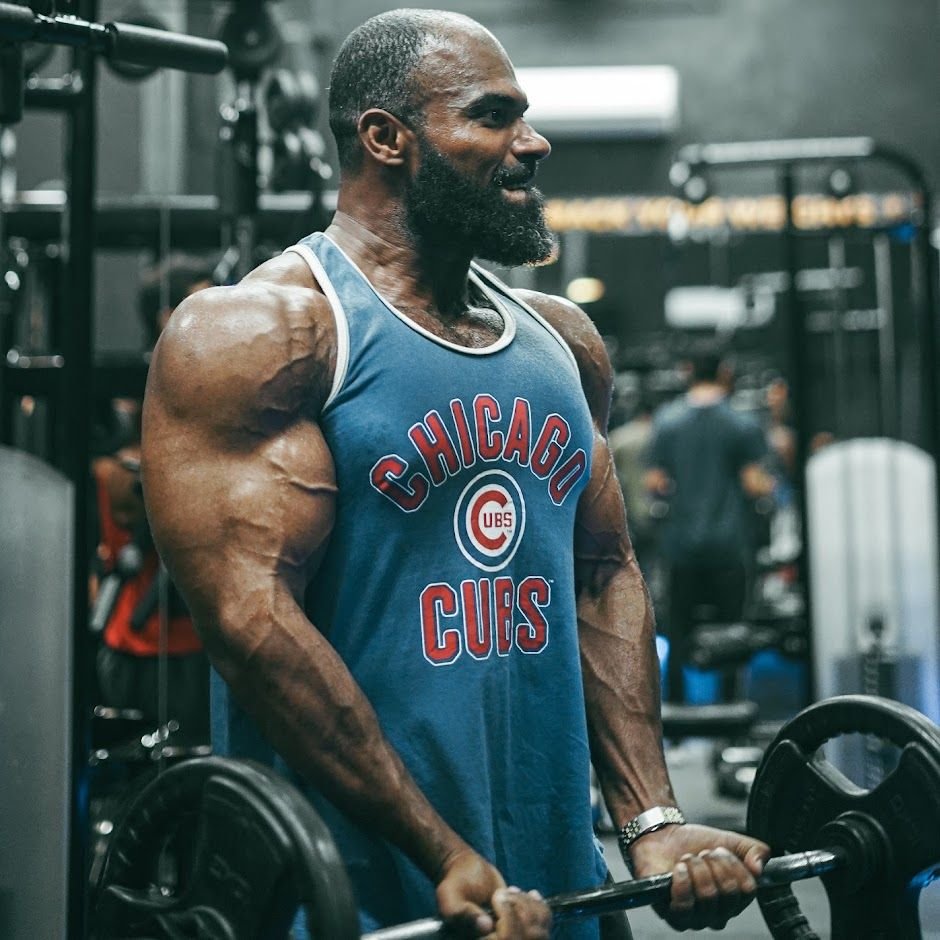 Athlete performing barbell curls